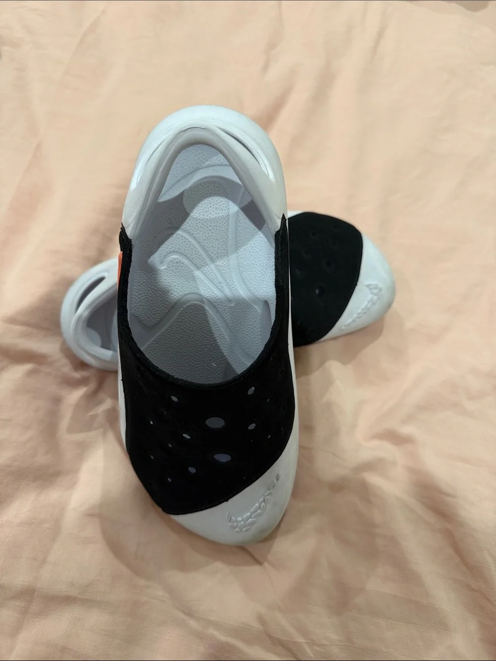 Nike Black and White Slip-On Clogs with Orange Accent
